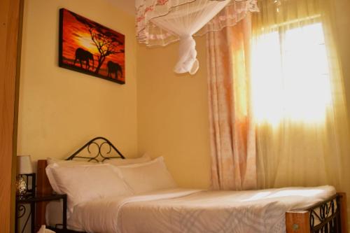 Katil atau katil-katil dalam bilik di Too's Nest apartment