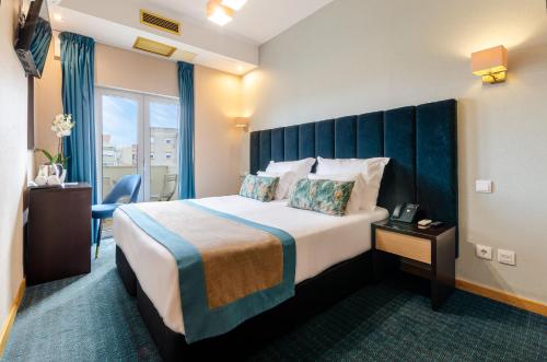 Letto o letti in una camera di Hotel DAH - Dom Afonso Henriques
