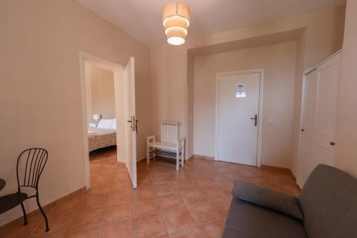 a living room with a couch and a room with a bed at Artis Mare in Pozzuoli