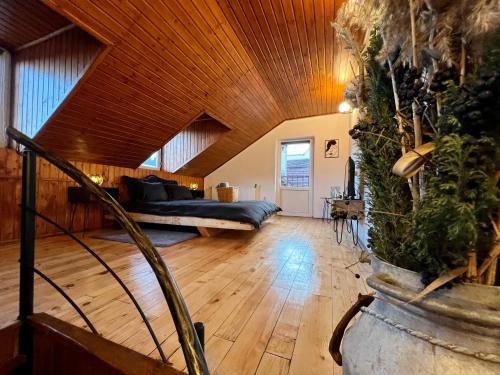 a living room with a couch and a wooden ceiling at Old Town by HYCO in Sighişoara
