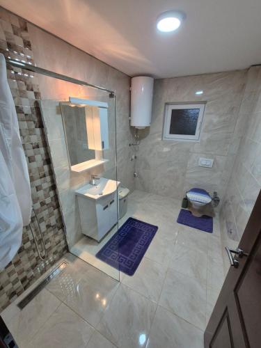 a bathroom with a shower and a sink at Bjance Lux Prijepolje in Prijepolje