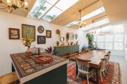 a dining room with a table and chairs at Summer Eternal Pool Villa Nimman in Chiang Mai