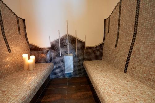 a room with two benches with candles in it at Appartements Gladbach in Heiterwang