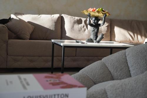 a living room with a table with a toy on it at Vienna Luxury Apartments in Dobra Voda