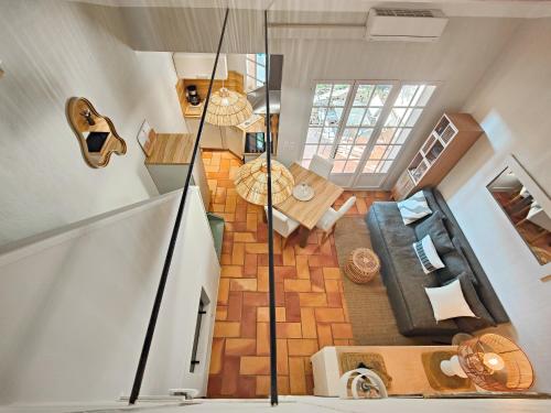 an overhead view of a living room with a guitar at Les Garrigues de la Vallée des Baux in Paradou