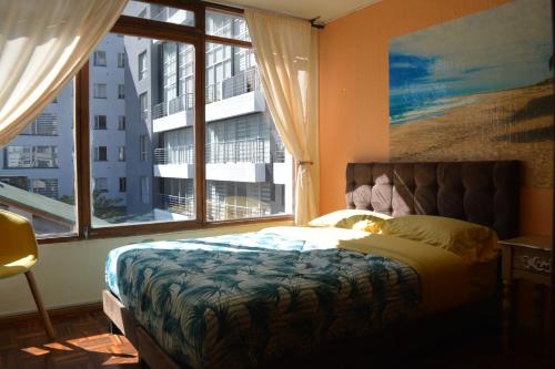 Postel nebo postele na pokoji v ubytování Blue house La Floresta
