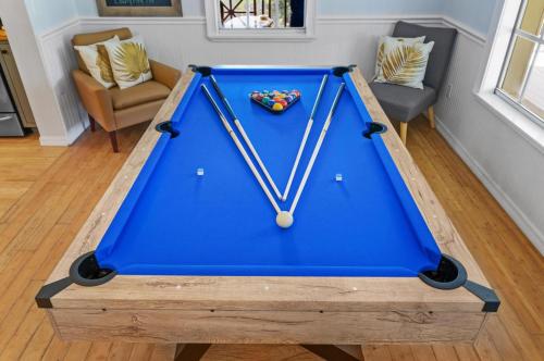 a pool table in the middle of a living room at #1 Largest Tampa Private Compound 13BR Sleeps 40 Heated Pool Spa in Tampa