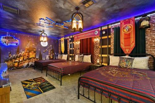 a bedroom with two beds and a wall mural at Top Luxury Villa Storey Lake mins to Disney in Kissimmee