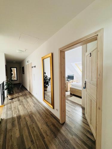 an empty room with a door and a mirror at Farma Kalhov in Kalhov