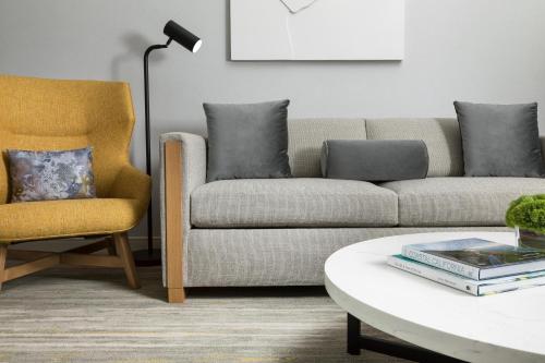 a living room with a couch and a chair at The Westin Long Beach in Long Beach
