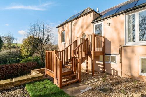 a wooden staircase leading up to a house at Artist's Studio in Piddlehinton