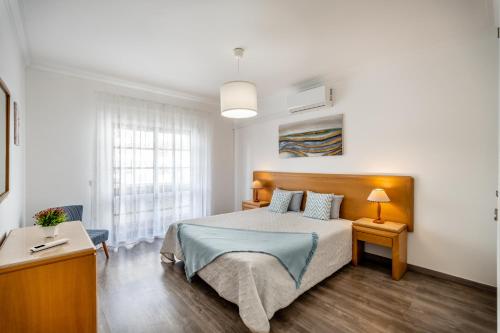 Postel nebo postele na pokoji v ubytování VilaRosa BeachPearl by CC 202