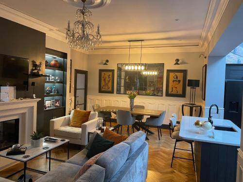 a living room with a couch and a table at East Cliff in Preston