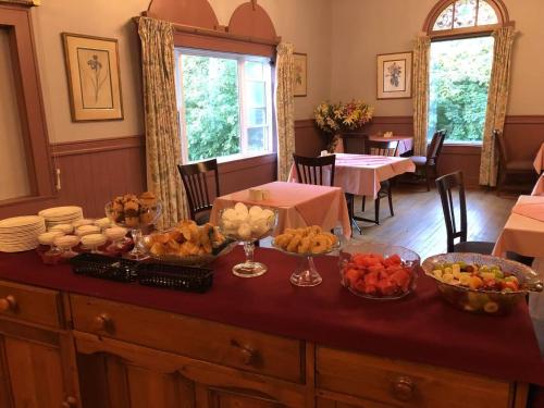 a table with a bunch of food on top of it at Braeside Country Inn in Pictou