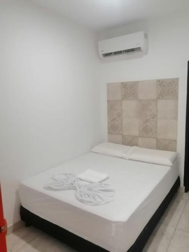 Postel nebo postele na pokoji v ubytování AVENTURa HOTEL