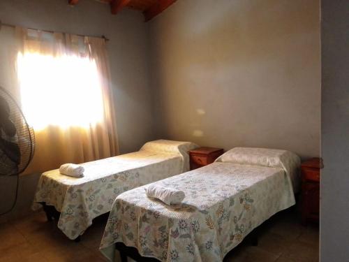 Una cama o camas en una habitación de Narciso Home