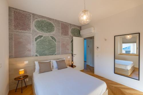 Postel nebo postele na pokoji v ubytování Residence Moretti piano primo