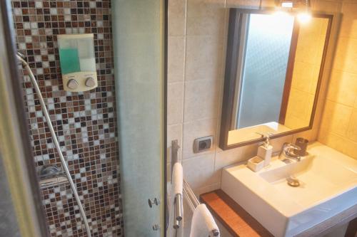 a bathroom with a sink and a mirror at B&B Terrazza dell'Etna in Mascalucia