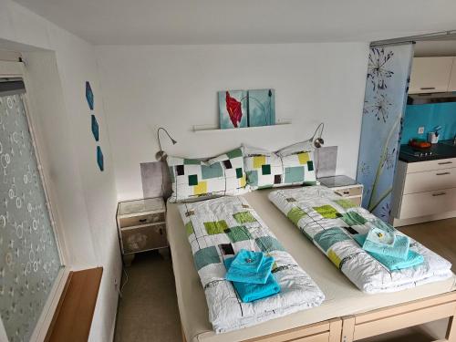 a bedroom with a bed with two pillows at BnB Mönthal im Jurapark in Mönthal 