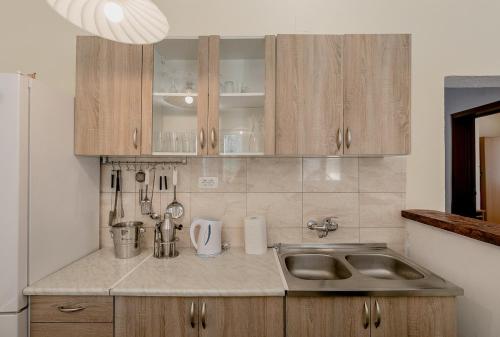 a kitchen with a sink and a counter top at Villa Relax in Herceg-Novi