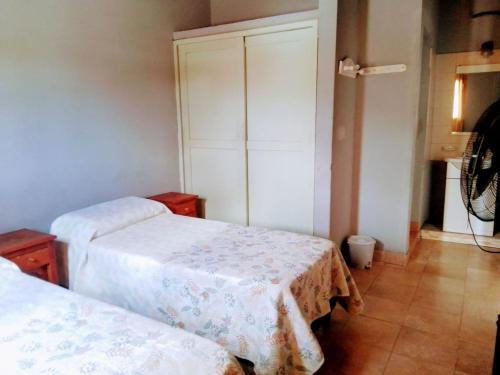 Una cama o camas en una habitación de Narciso Home