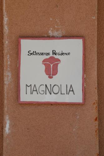 a sign on a wall with the name of macrolilli at Settessenze Residence & Rooms in Agropoli