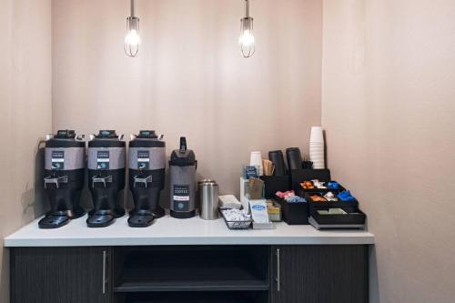 a counter with several water bottles on top of it at Residence Inn Shreveport Airport in Shreveport