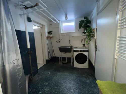 a small room with a sink and a window at The Villa in Stugun