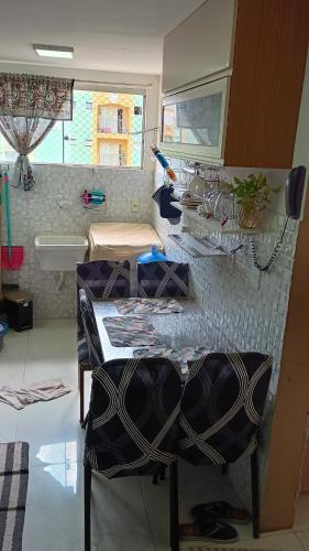 a room with a table and chairs in a room at COP30 Mobiliado Apt Belém in Belém