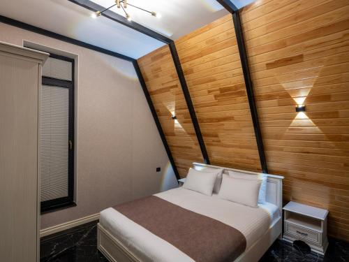 Ένα ή περισσότερα κρεβάτια σε δωμάτιο στο Quba Cozy House