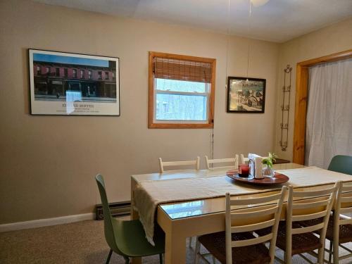 a dining room with a table and chairs at Charming, Pet-friendly Lake front Retreat WiFi in Ferndale