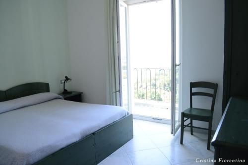 Säng eller sängar i ett rum på Hotel La Ginestra