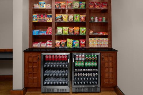 a drink stand in a store with drinks and food at Larkspur Landing Extended Stay Suites Roseville in Roseville