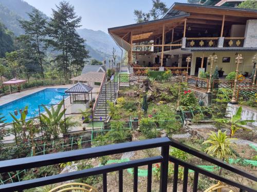 a view of a house with a swimming pool at Nature's Nest Resort in Rongli