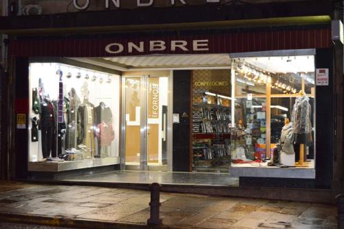 a store front window of a clothing store at Pensión Residencia Fornos in Santiago de Compostela