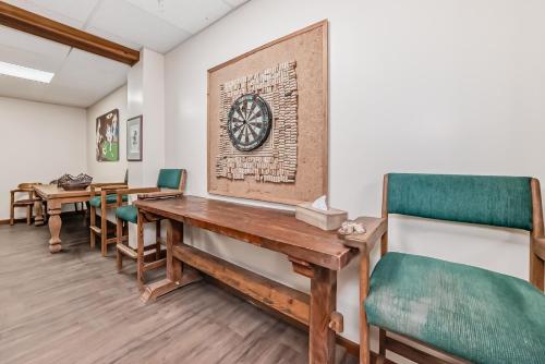 a dining room with a wooden table and chairs at Terracana Ranch Resort in Tete Jaune Cache