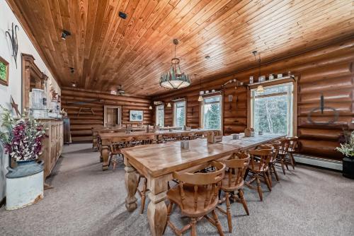 a large dining room with a long table and chairs at Terracana Ranch Resort in Tete Jaune Cache