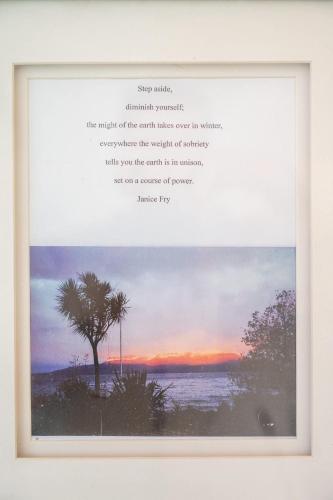 a framed picture of a painting of a tree and water at The Enclave in Rotorua