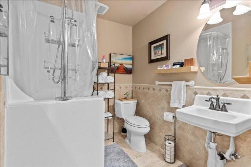 a bathroom with a sink and a toilet and a shower at Cozy 2.4 in Hayden