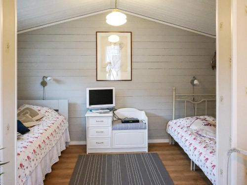 Ένα ή περισσότερα κρεβάτια σε δωμάτιο στο 5 person holiday home in FALKENBERG-By Traum