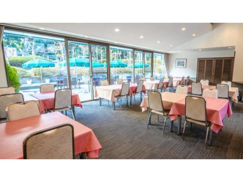 a conference room with tables and chairs and windows at Le Nessa Akazawa - Vacation STAY 03714v in Futo