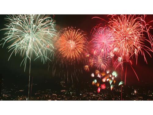a group of fireworks exploding in the night sky at Le Nessa Akazawa - Vacation STAY 03717v in Futo
