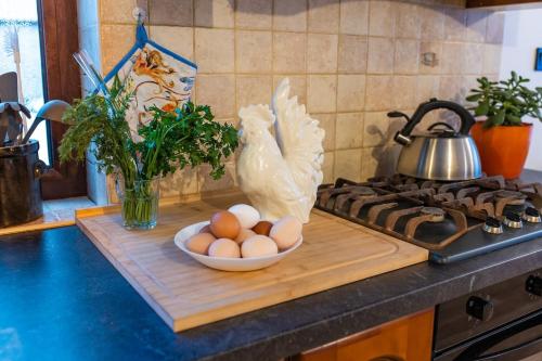 a kitchen counter with a bowl of eggs on a cutting board at Agroturystyka Świętego Józefa in Chrzypsko Wielkie