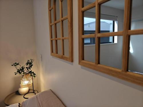 a living room with a couch and a window at A Quiet Modern and Brand New Gem in Lower Hutt