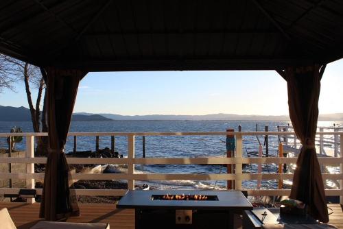 a gazebo with a view of the water at Modern Waterfront Home in Lucerne in Lucerne