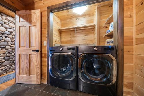 a laundry room with two washer and dryer at Private•OMG Views•Hot Tub•Firepit•10 min to Downtown in Blue Ridge