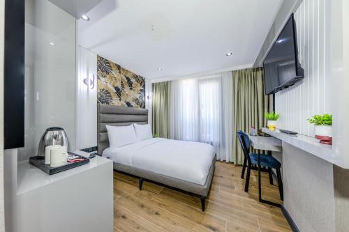 Postel nebo postele na pokoji v ubytování Dedem Hotel Premium - Çorlu