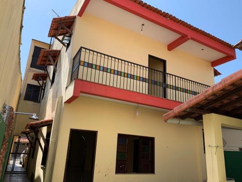 a building with a balcony on the side of it at COP 30 Alto de Pinheiros in Belém