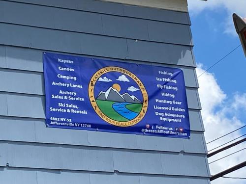 a sign on the side of a building at In the clouds your cozy- lake house in Swan Lake