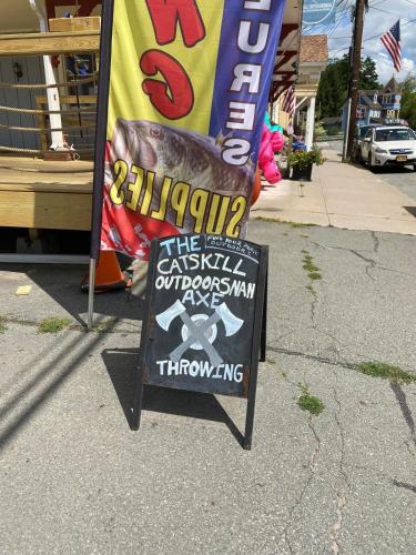 a sign for a restaurant with a grilled sausage on it at In the clouds your cozy- lake house in Swan Lake